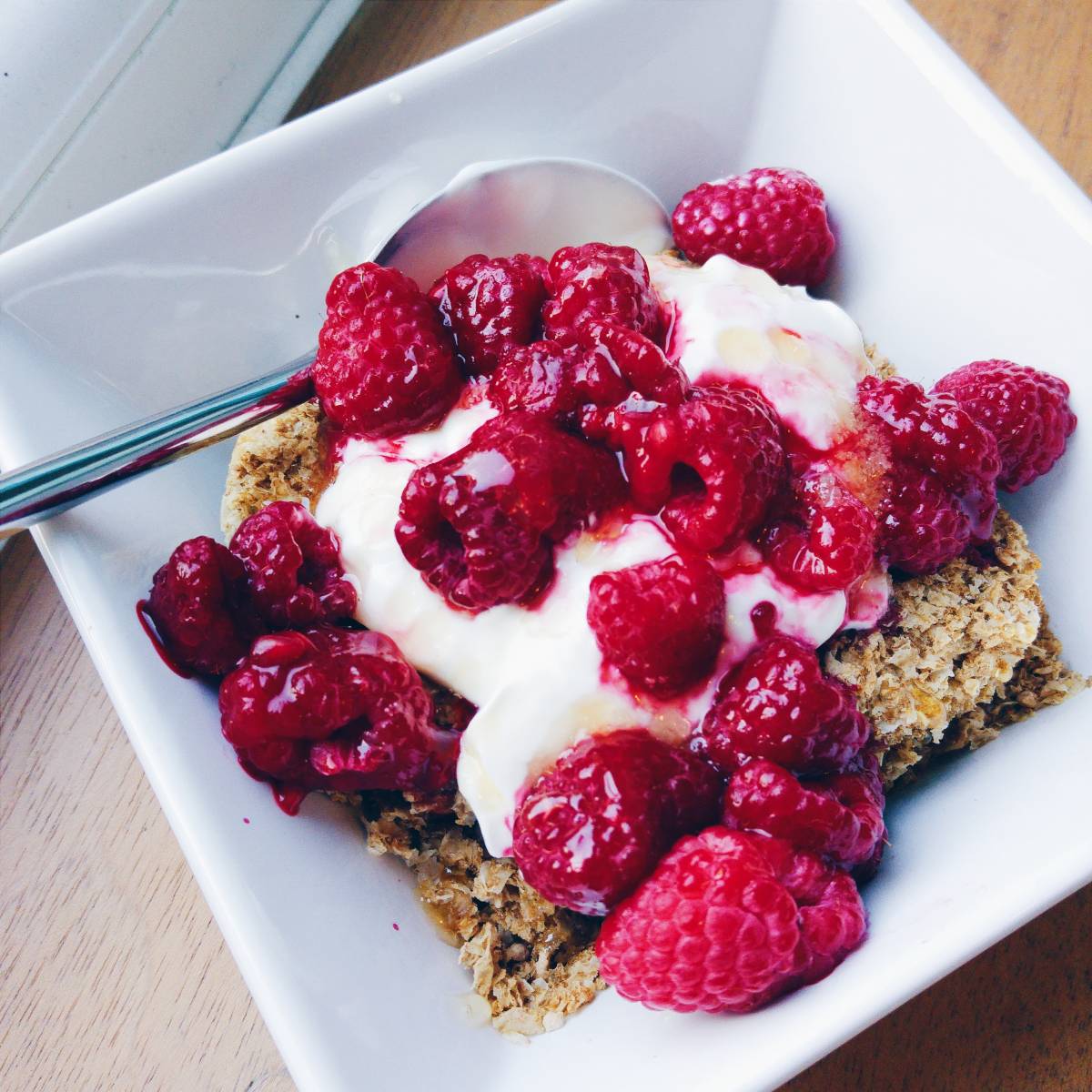 Protein Weetabix with Greek yoghurt, raspberries and honey