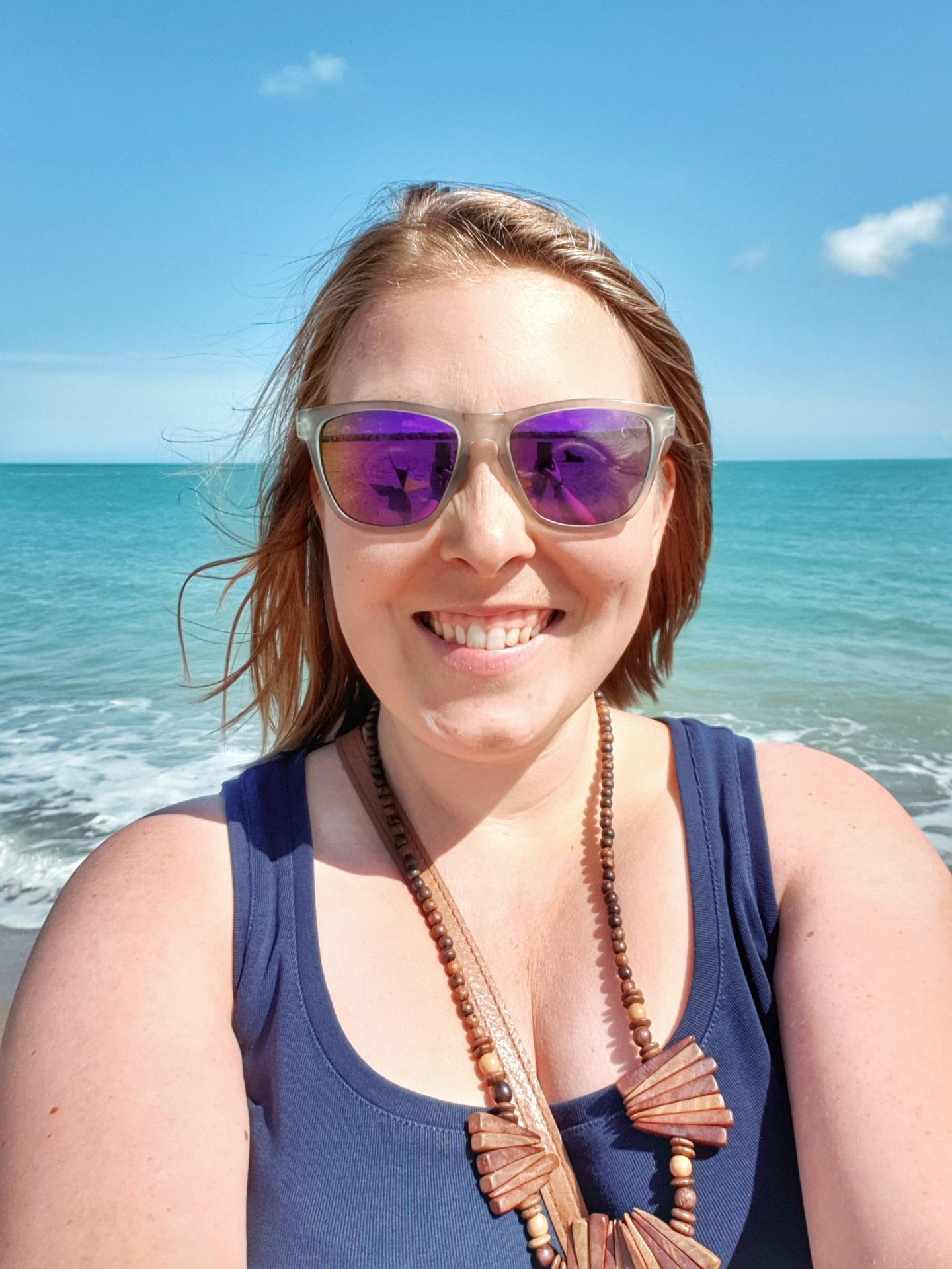 Beki (Miss Wheezy) selfie on the beach in front of the sea