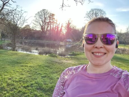 Running selfie in front of pond