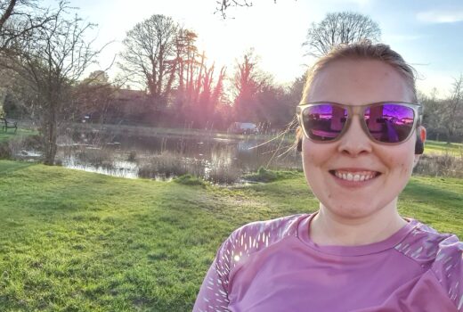 Running selfie in front of pond