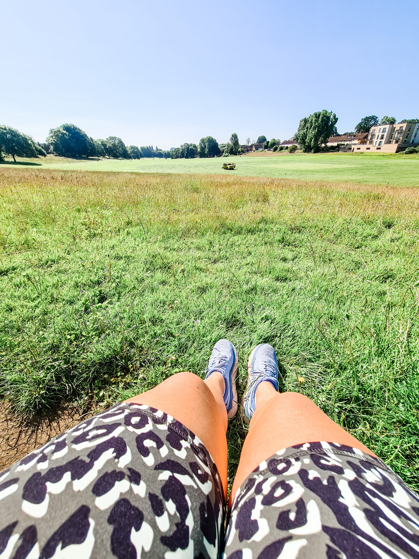 View of legs wearing shorts and running shoes